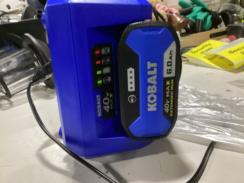Condition photo showing As Is for kobalt 40v max 4.0 ah extended run battery + charger kit fast charging