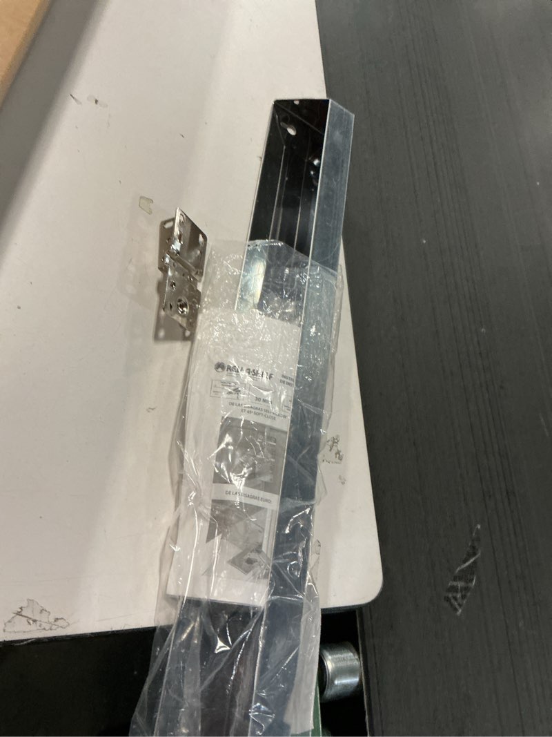 Condition photo showing As Is for Rev-A-Shelf 28" Slim Tip-Out Sink Tray for Kitchen and Bathroom Base Cabinets, Large Pull Out Stainless Steel Storage Organizer, Silver, 6541-28-52 28" x 3" x 1.7"