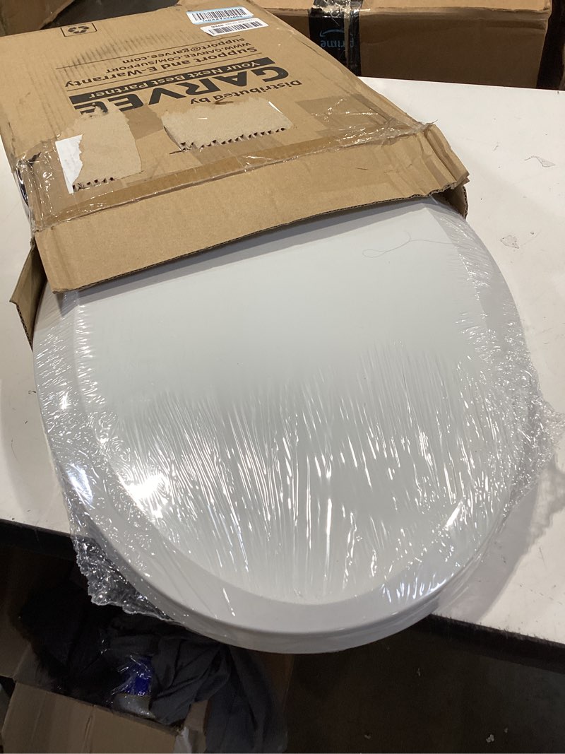 Condition photo showing As Is for durable elongated toilet seat with slow soft close - easy to install and clean, never loosens - white, fits most elongated toilets white elongated without toddler seat
