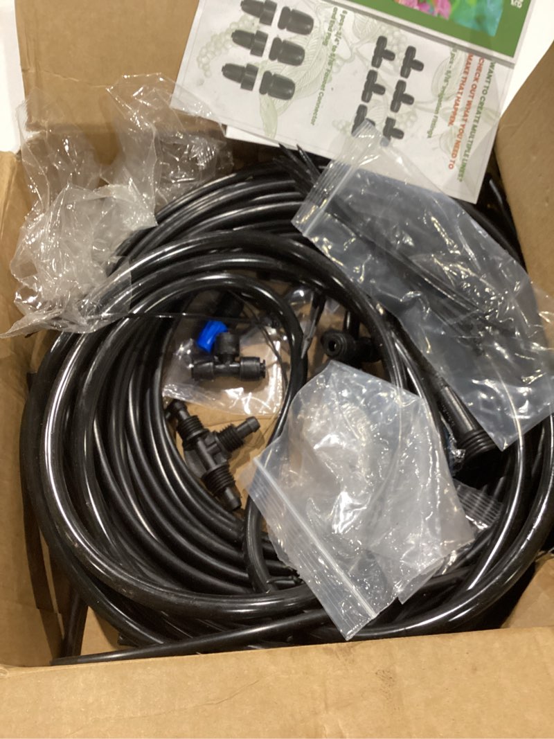 Condition photo showing As Is for bonviee 247ft drip irrigation system, automatic garden watering system kit with 50ft 5/16” & 1/4” drip tubing, quick-to-connect fittings, adjustable drip emitters for raised beds, greenhouse, lawn 247 ft - 50 ft 5/16" tubing + 197 ft 1/4" tubing
