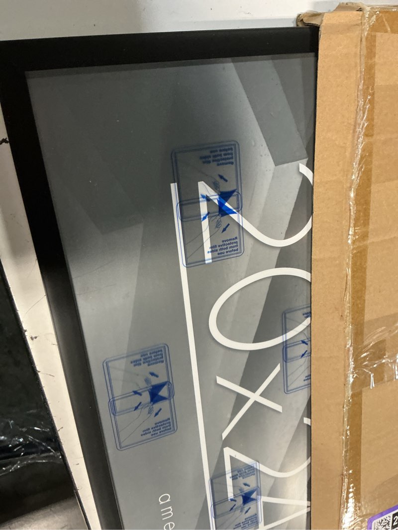 Condition photo showing As Is for americanflat 20x24 picture frame with polished plexiglass - streamline collection - thin border picture frame for wall display - hanging hardware included - black 20x24 black