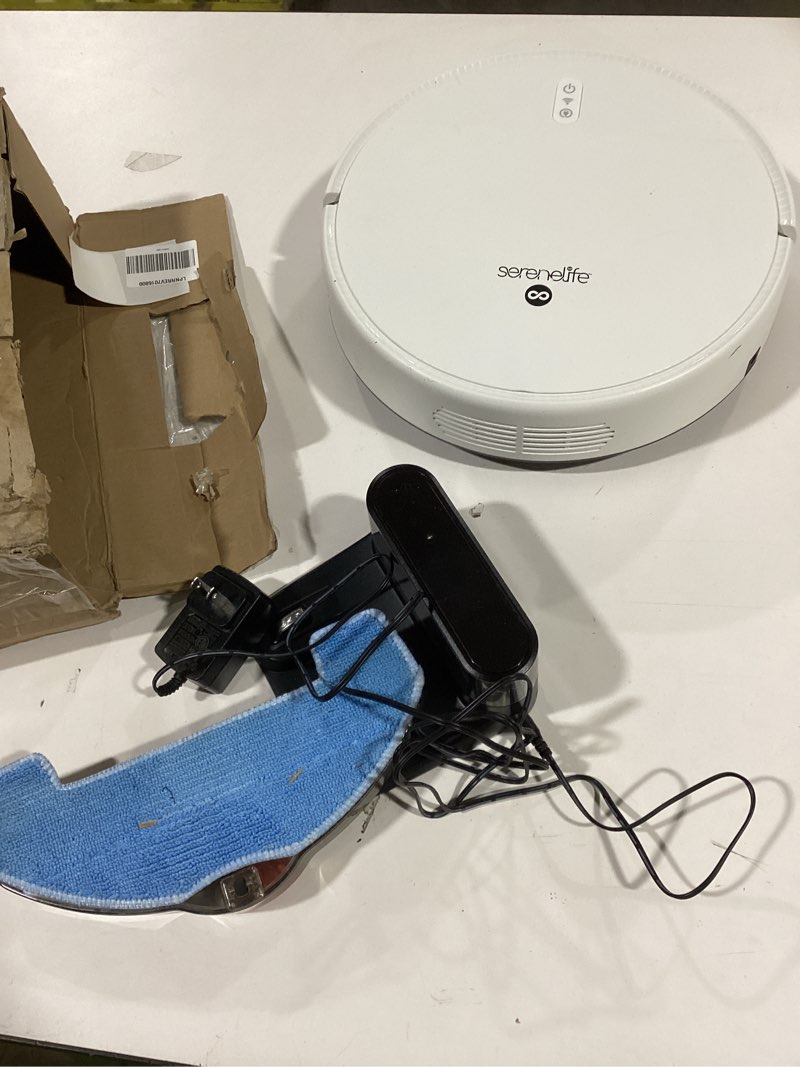 Condition photo showing As Is for SereneLife Smart Robot Vacuum Cleaner and Mop Combo, App Control, 3 Cleaning Modes, Anti-Fall Sensors, Self-Charging, High Suction Ideal for Pet Hair, Carpet and Hard Floors, White Classic, White
