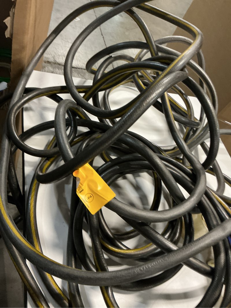 Condition photo showing As Is for air hose continental black with yellow stripe pliovic 300psi 3/8” x 50’ with brass fittings