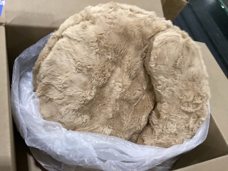 Brown small fuzzy round dog bed