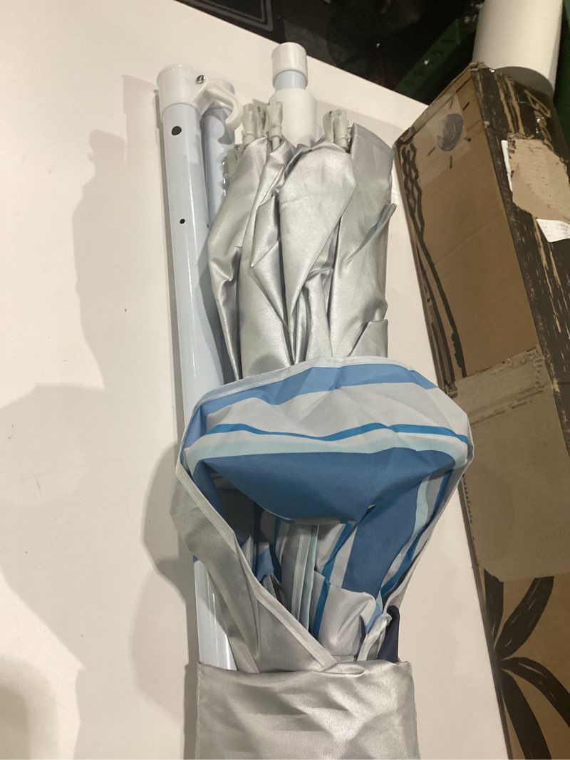 Condition photo showing Good Condition for lottafun 6ft beach umbrella - heavy duty wind resistant uv 50+ portable sun shade with sand anchor & carry bag, outdoor folding umbrella for beach, pool, patio, garden (blue stripe) no tilt the sand needs to exceed the spiral 6inch blue wave stripe
