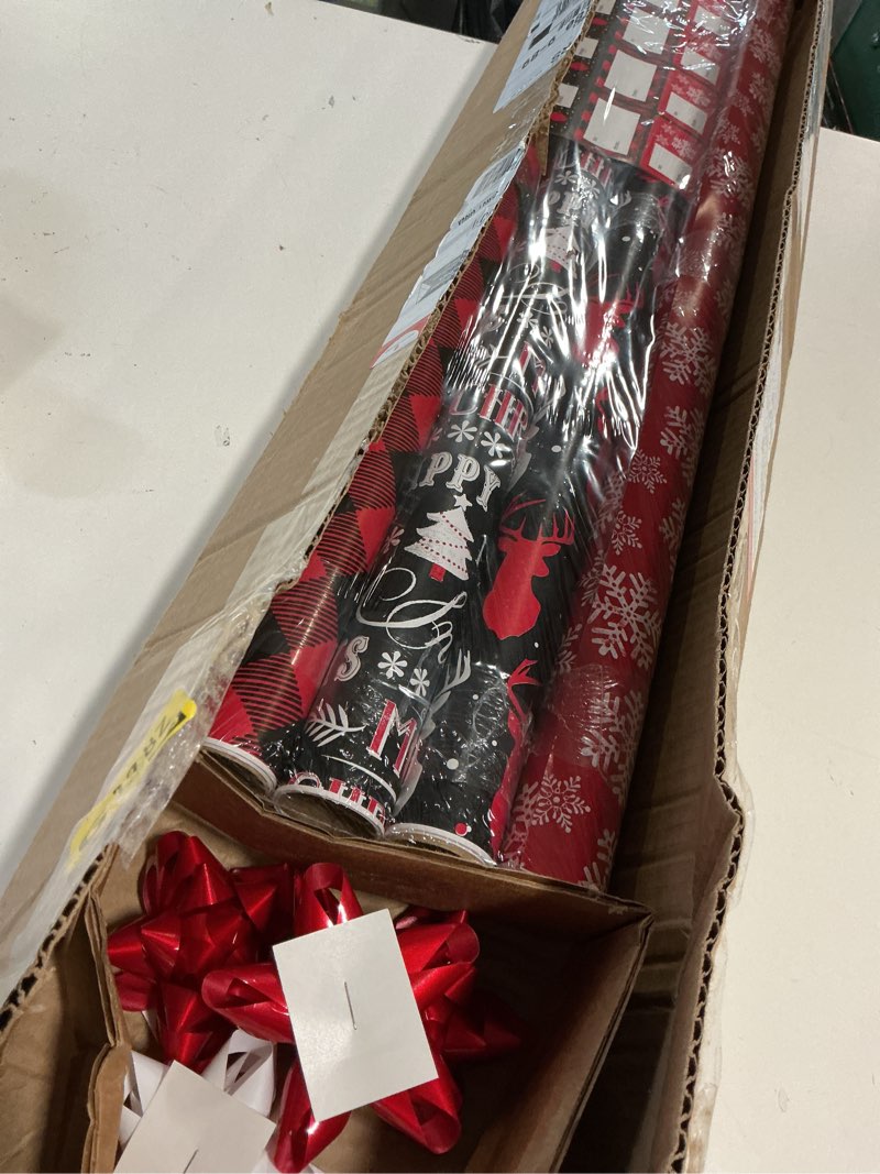 Condition photo showing New/Like New for American Greetings 120 sq. ft. Red and Black Christmas Wrapping Paper Set with Cut Lines (4 rolls 30 in. x 12 ft., 7 Bows, 30 Gift Tags), Christmas Text, Plaid, Reindeer and Snowflakes