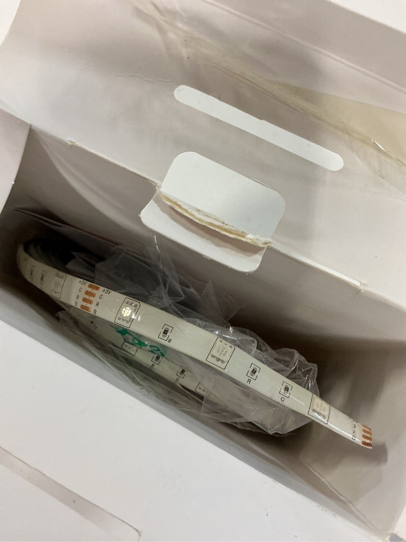 Condition photo showing As Is for bell + howell 24-ft led multicolor tape light