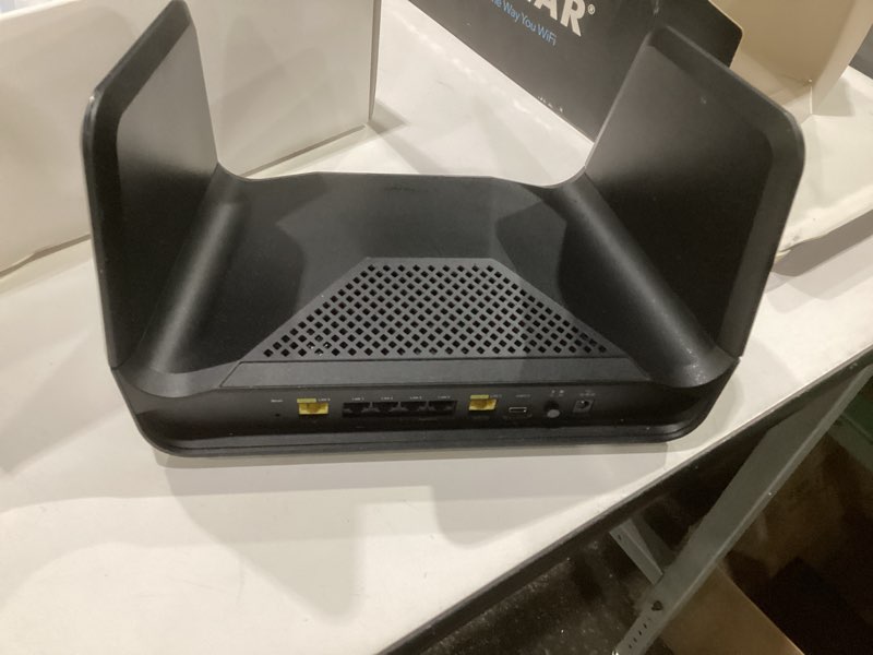 Condition photo showing As Is for netgear nighthawk tri-band wifi 6e router (raxe300) - security features, axe7800 wireless gigabit speed (up to 7.8gbps), new 6ghz band, 8-streams cover up to 2,500 sq. ft., 40 devices, not tested