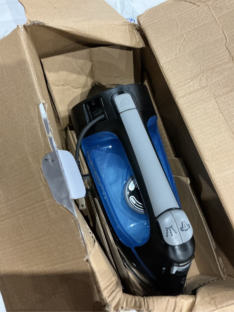 Condition photo showing As Is for retractable cord iron with stainless steel soleplate, steam, spray and blast settings and auto shutoff
