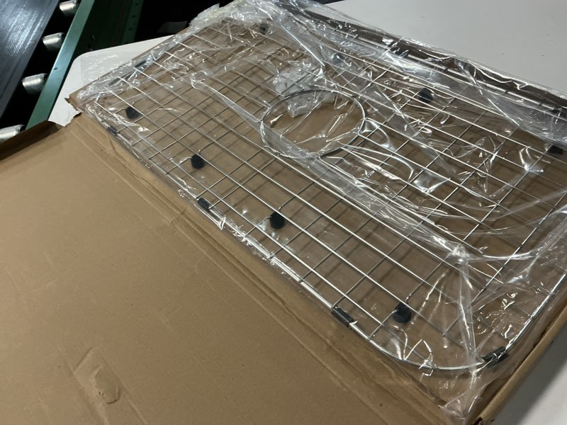 Condition photo showing Good Condition for serene valley sink protector grid 26-1/16" x 14-1/16", centered drain with corner radius 3-1/2", 304 stainless steel material nlw2614c