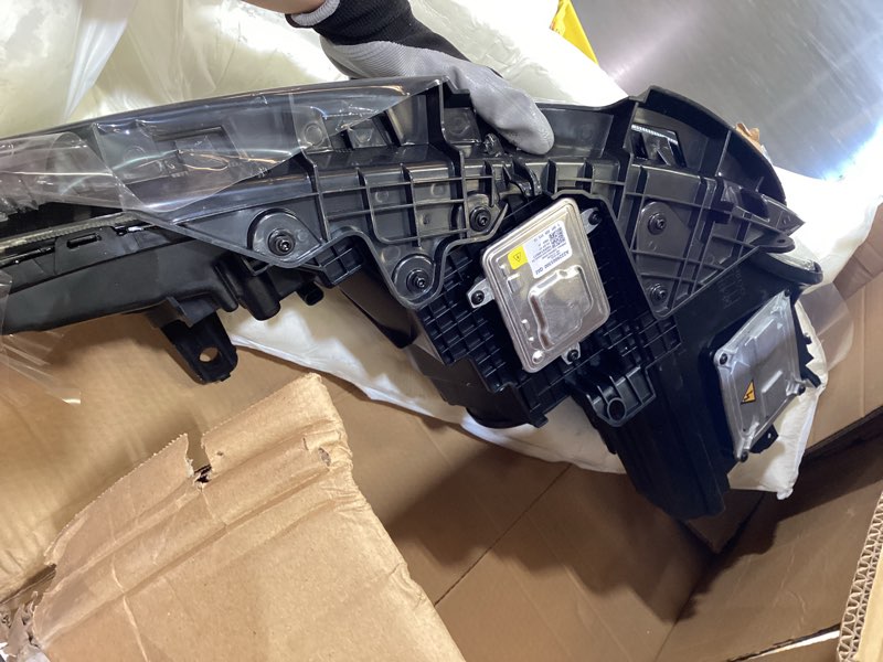 Condition photo showing As Is for headlight assembly