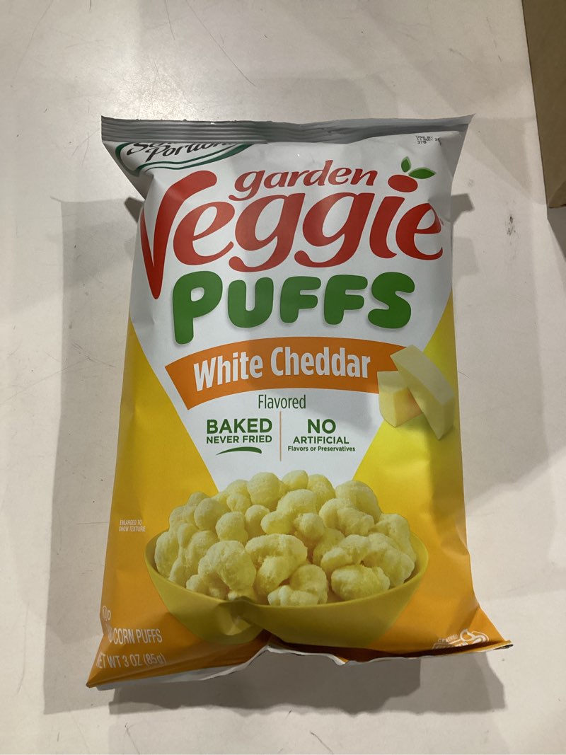Condition photo showing New/Like New for (best by 05/11/2026) sensible portions veggie puffs, white cheddar flavor, gluten-free chips, 3.75 ounce bag, 6-pack white cheddar 3.75 ounce (pack of 6)