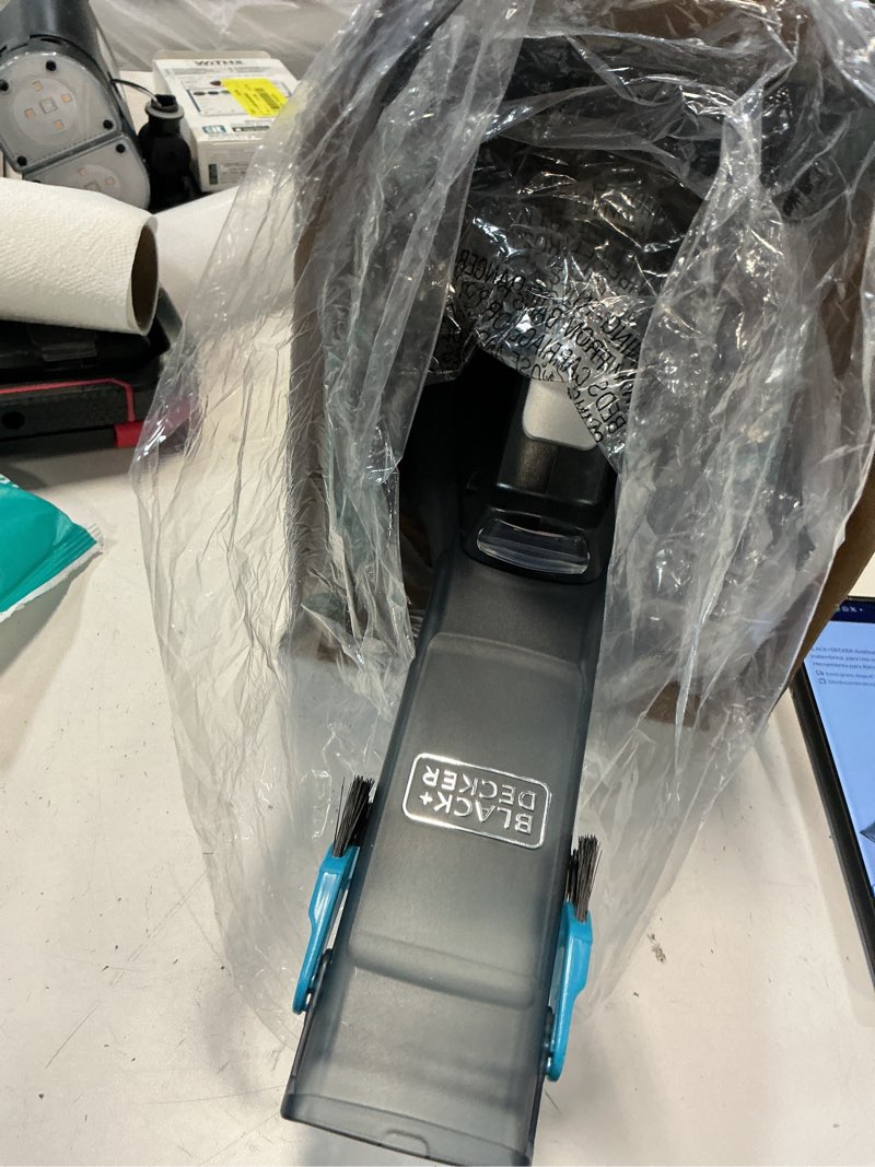 Condition photo showing As Is for black+decker dustbuster reveal cordless handheld vacuum, for car and home use, with led lights and crevice tool, hlvd320j, black