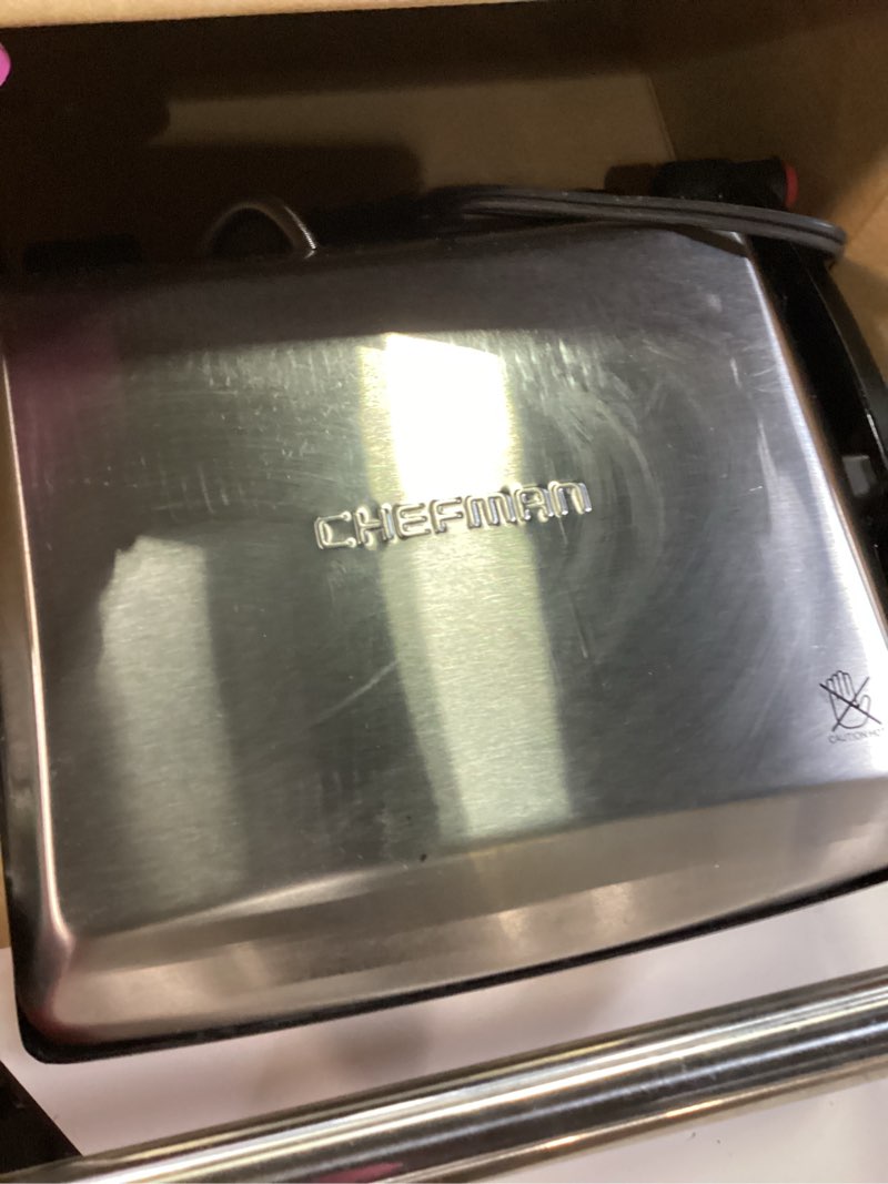 Condition photo showing As Is for Chefman Panini Press Grill and Gourmet Sandwich Maker Non-Stick Coated Plates, Opens 180 Degrees to Fit Any Type or Size of Food, Stainless Steel Surface and Removable Drip Tray, 4 Slice, Black 4 Slice - Standard