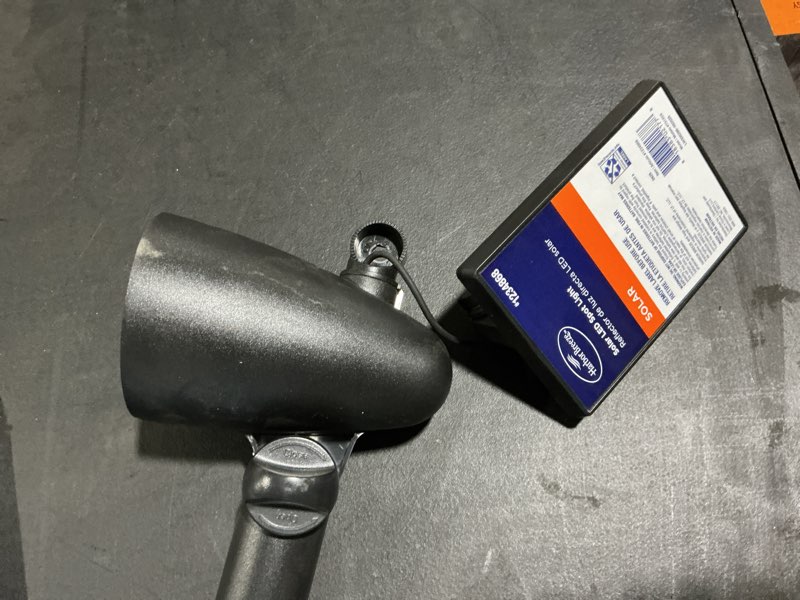 Condition photo showing As Is for harbor breeze 60 -lumens 1 -watt black solar led spot light