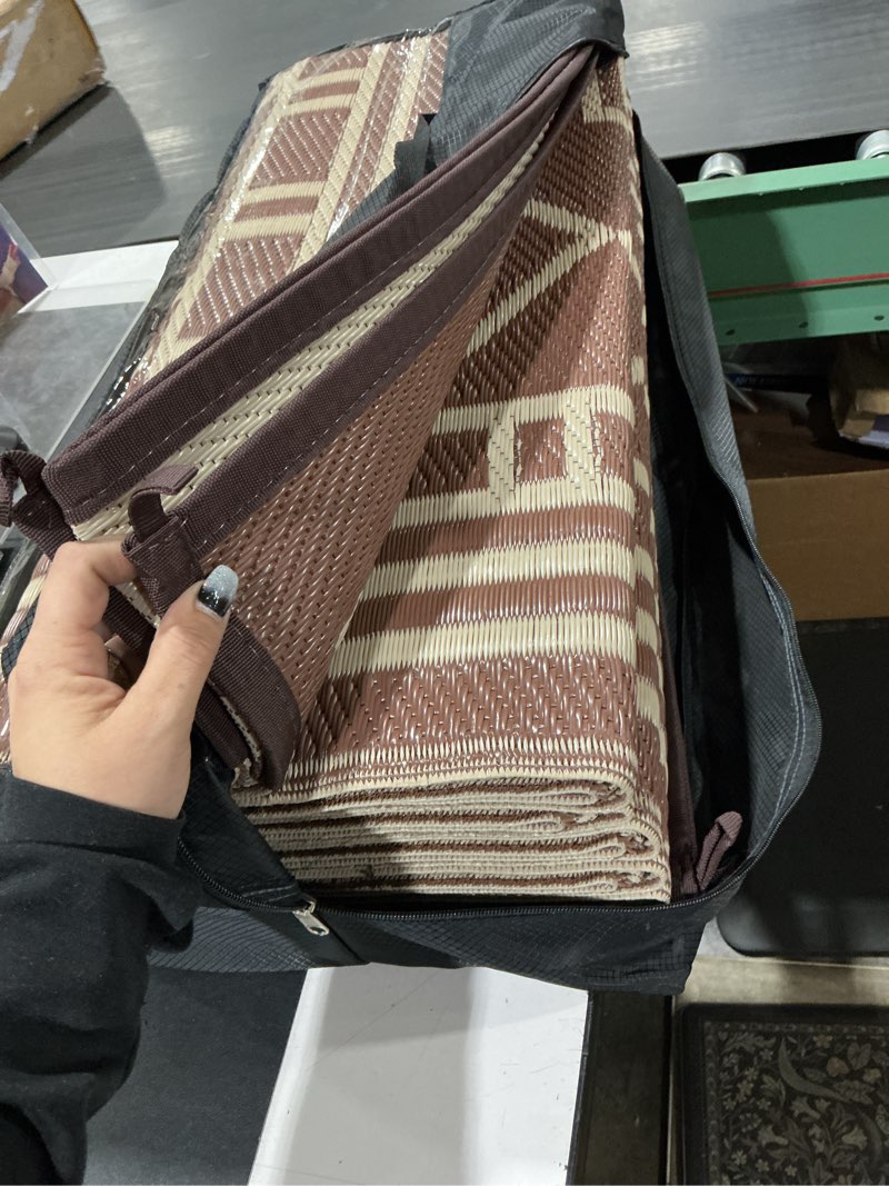 Condition photo showing Good Condition for genimo outdoor rug waterproof for patio decor, 10'x20' foldable reversible plastic straw carpet, outside area mat for rv, deck, picnic, porch, camper, balcony, beach, coffee & brown