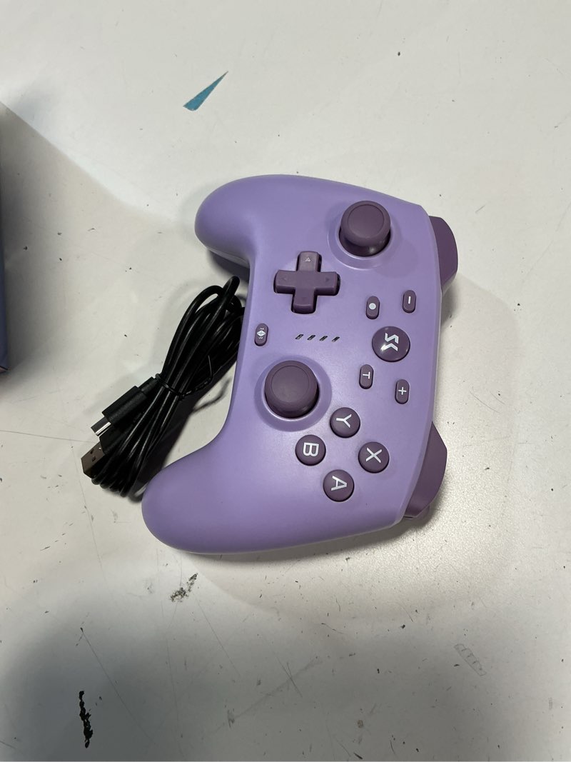 Condition photo showing As Is for wireless switch controller for switch/switch 2/lite/oled/pc controller with 2.4g adapter, purple switch controller with hall joysticks & hall triggers, switch pro controller with wake-up, 2 back programmable buttons, turbo function
