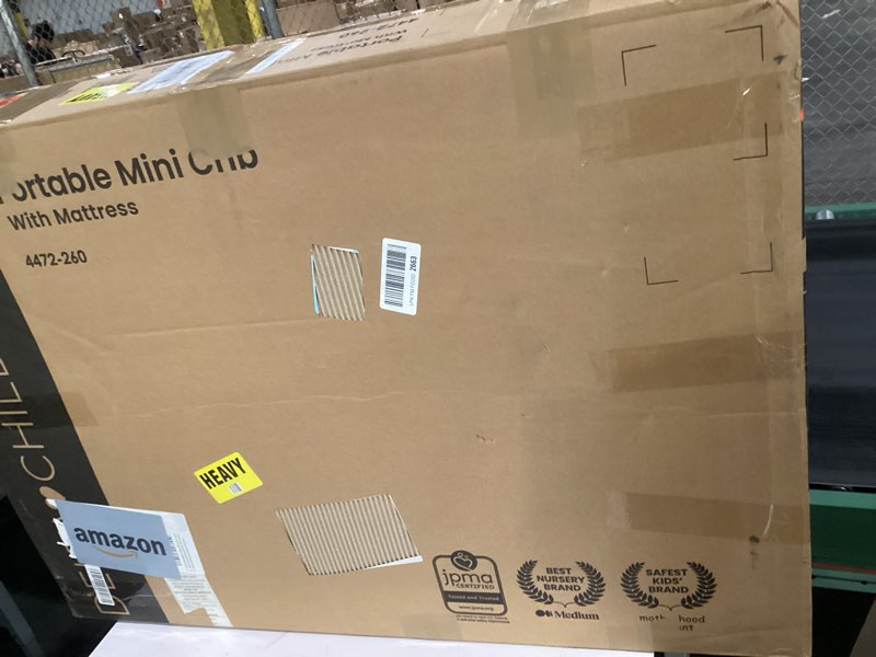 Condition photo showing As Is for Delta Children Folding Portable Mini Baby Crib with 1.5-inch Mattress - Greenguard Gold Certified, Natural Natural Crib