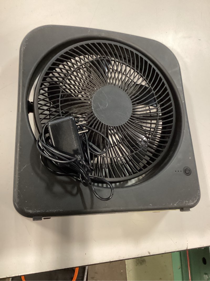 Condition photo showing As Is for mainstays 9" portable fan, which is a compact black box fan with a circular