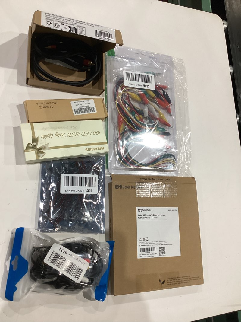 Condition photo showing Good Condition for assorted lot of electronics (headphones, small gadgets, headsets, etc.) 
