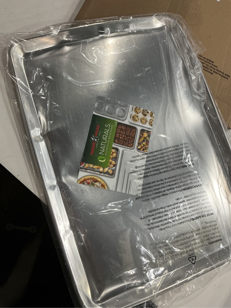 Condition photo showing As Is for Nordic Ware Extra Large Baking Sheet, 21 x 15 inches, XL Big sheet pan Natural Uncoated Aluminum, Reinforced Steel Rim Prevents Warping, 1pk Big Sheet