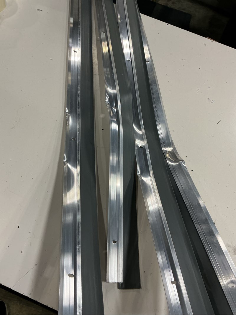 Condition photo showing As Is for pack of 4,m-d building products 69644 36 in. white aluminum and vinyl heavy-duty screw-on door sweep white 36 in