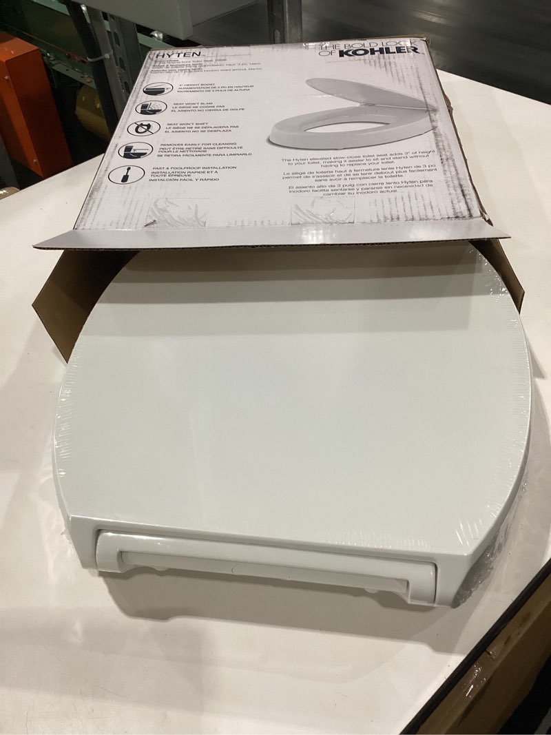 Condition photo showing New/Like New for kohler 25876-0 hyten 3" height, elevated soft close round toilet seat, contoured seat with grip-tight bumpers, quick-attach hardware, white white round