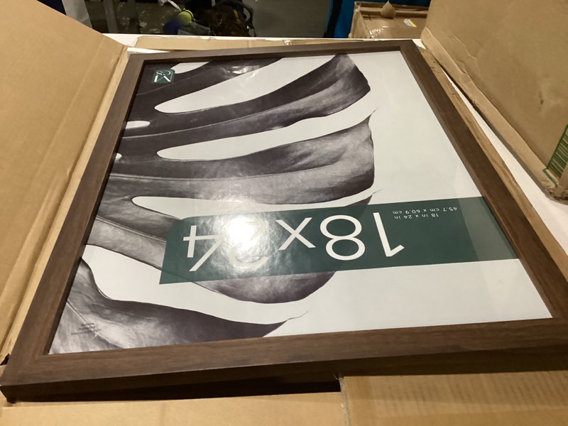 Condition photo showing As Is for damaged mcs studio gallery 18x24 poster frame walnut woodgrain engineered wood, vertical & horizontal wall hanging large picture frame for photos, posters & art prints (1-pack) 1-pack walnut woodgrain 18x24