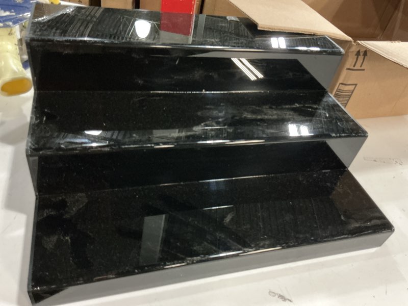 Condition photo showing As Is for 3 pcs black acrylic display risers for figures, collectibles, jewelry and cosmetics, tiered stands for party table, home decor and retail use black 3pcs