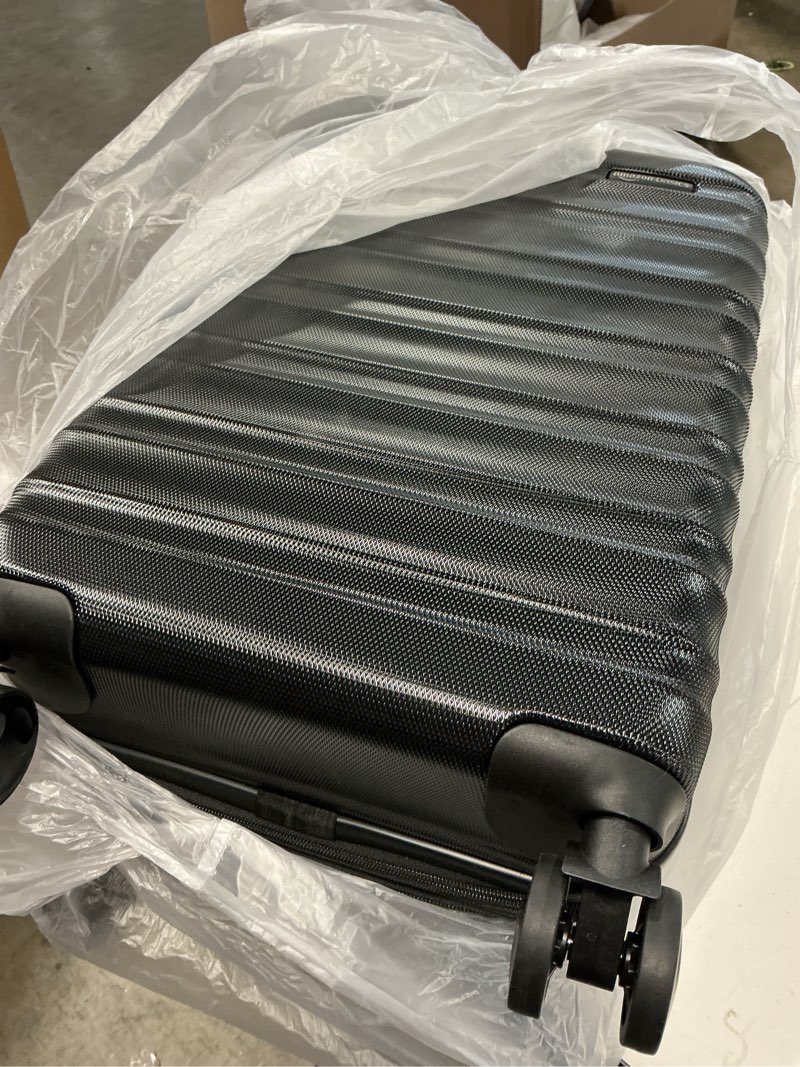 Condition photo showing As Is for Amazon Basics 21" Hardside Carry-On Luggage, Hardshell Suitcase With Wheels, Expandable For Up to 25% More Space, With Scratch-Resistant Surface, Four Multi-directional Wheels, Black Black Carry-On