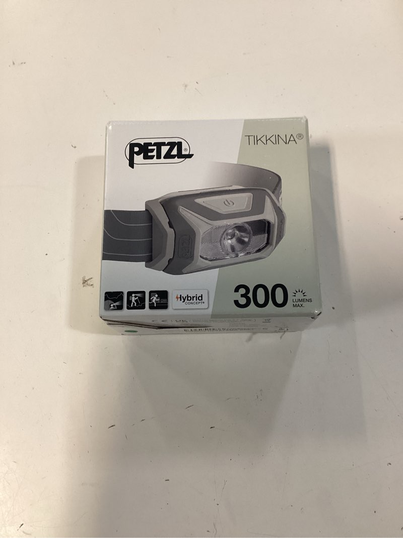 Condition photo showing New/Like New for petzl tikkina headlamp - compact, easy-to-use 300 lumen headlamp, designed for hiking, climbing, running, and camping