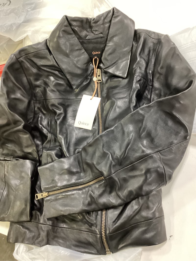 Condition photo showing New/Like New for 100% leather cropped zip-front jacket medium color true black 