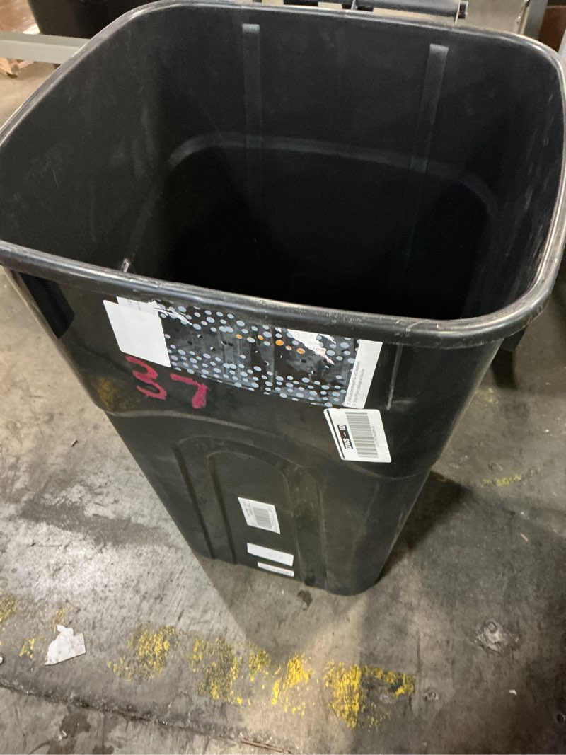 Condition photo showing As Is for united solutions 32 gallon outdoor waste garbage bin with attached lid, heavy-duty handles, snap lock , wheeled trashcan, black