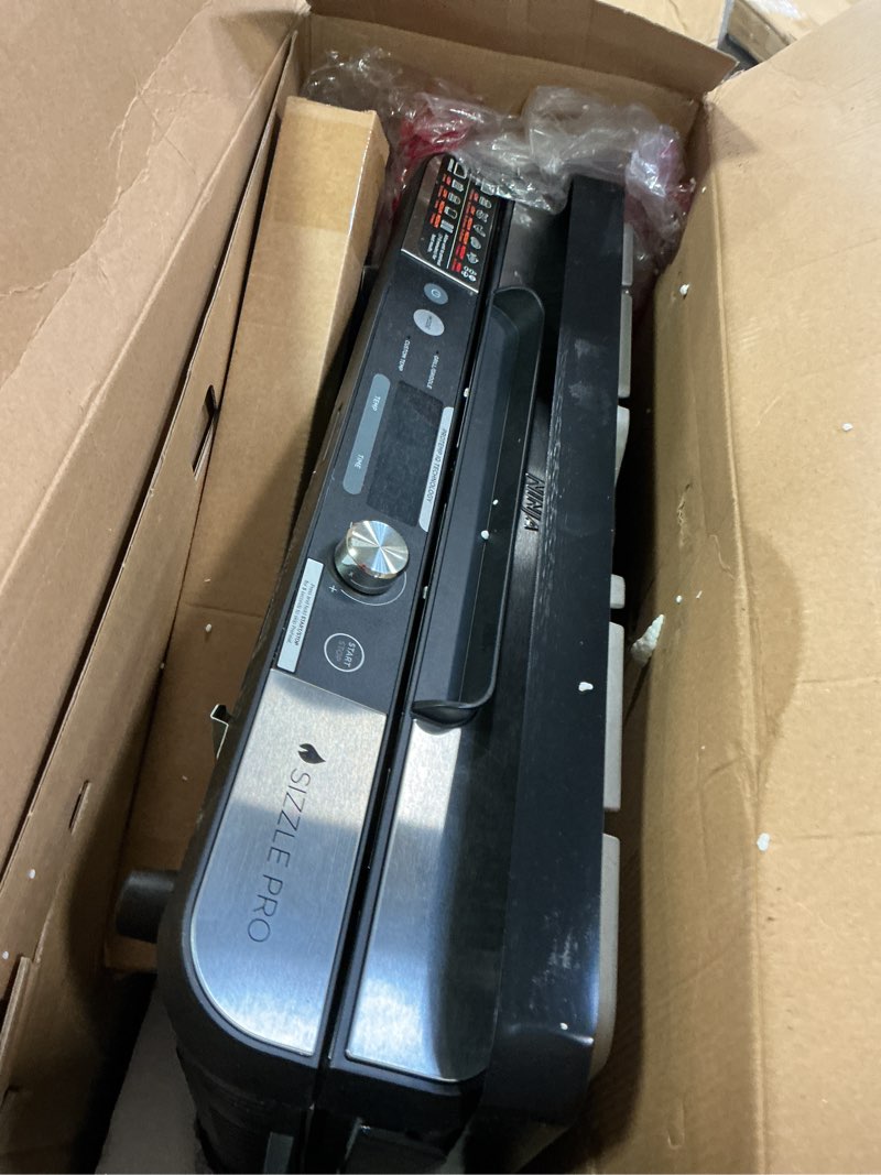 Condition photo showing As Is for Ninja Sizzle Pro XL 20-Inch Indoor Griddle + Grill, Detachable Ventilated Lid, Grease Control, Ceramic Nonstick Plates, Even Edge-to-Edge Cooking, Extra Large Capacity, Versatile, Silver, GX101