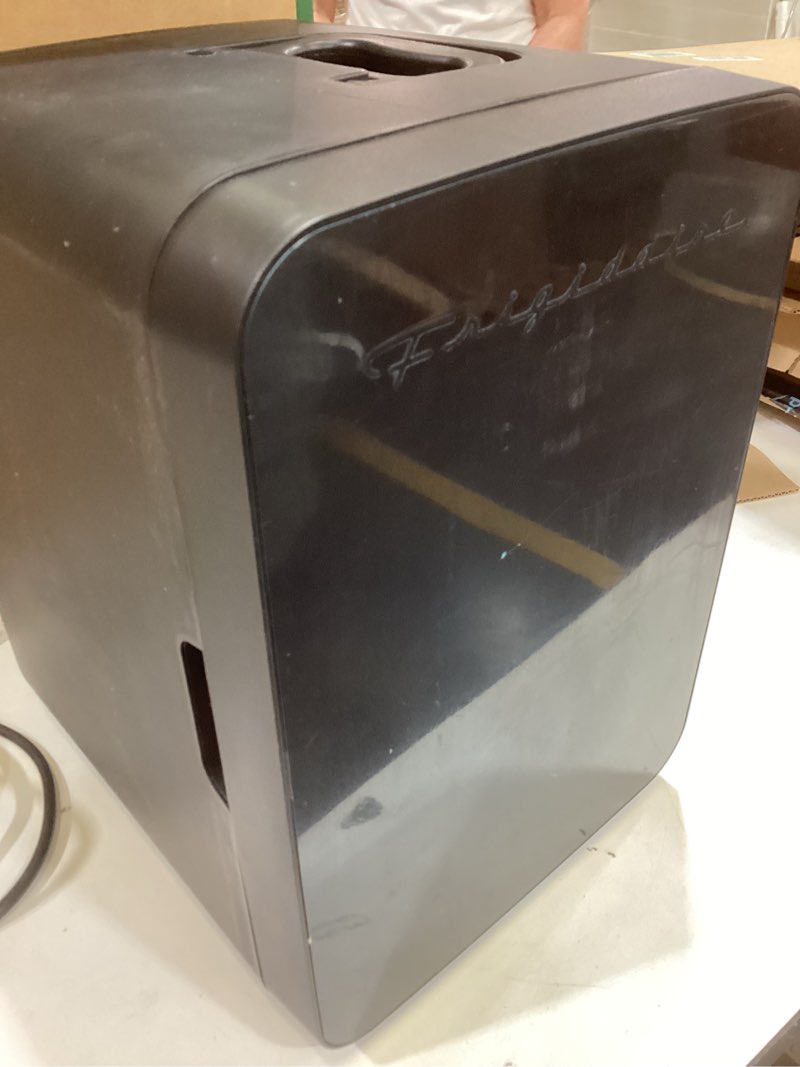 Condition photo showing As Is for frigidaire mini personal fridge cooler, countertop, holds up to 10l/15 cans, brushed black stainless rugged design, portable for skincare, makeup, car, office, bedroom, dorm room, or cabin