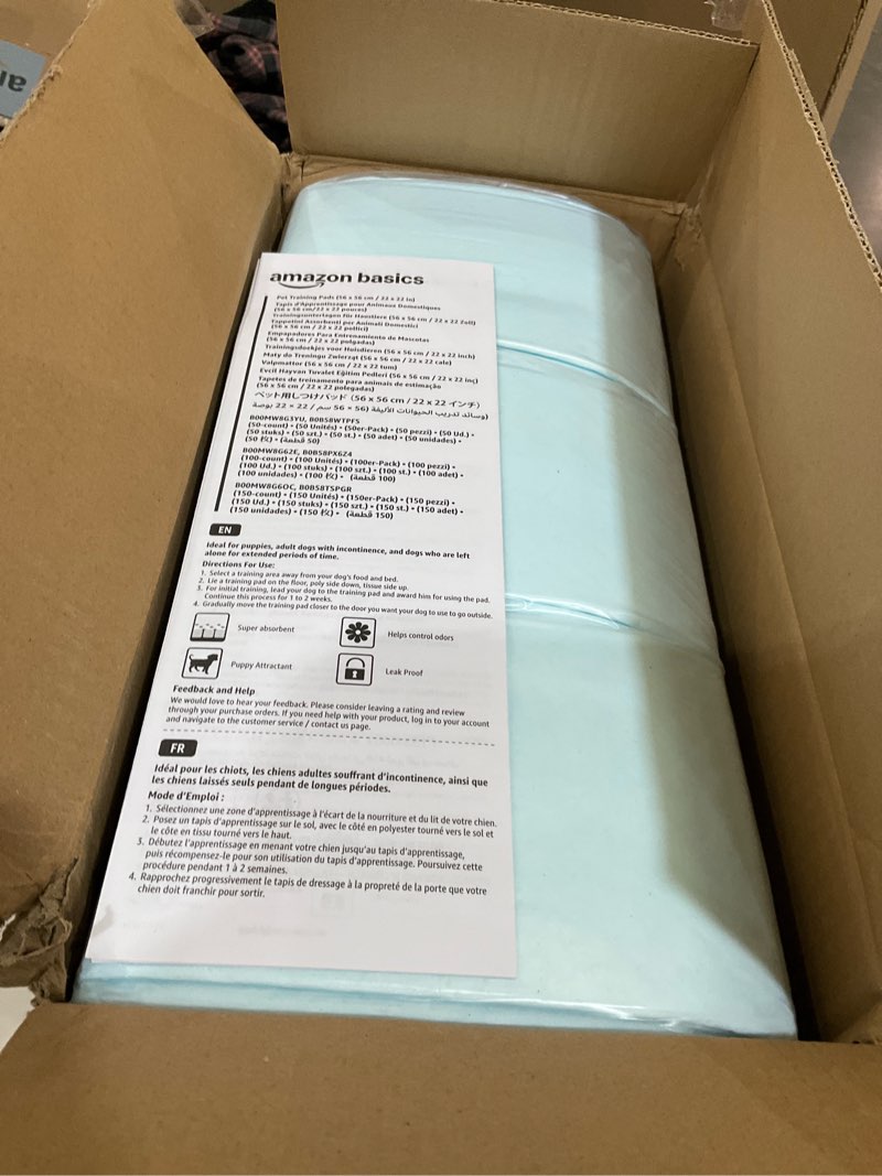 Condition photo showing New/Like New for amazon basics dog and puppy pee pads, 5-layer leak-proof super absorbent, quick-dry surface, potty training, regular (22x22"), 150 count, blue & white
