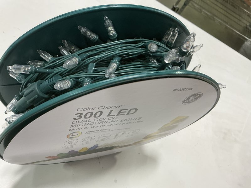 Condition photo showing As Is for DESC: BF GE CC 300-CT MICRO REE MODEL: 93959L0 GE Lighting Color Choice 300 Count BF Micro Bright Reel Lights - Warm White & Multicolor