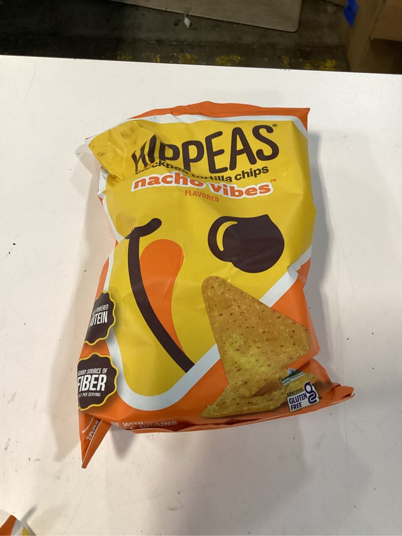 Condition photo showing New/Like New for bb 07/04/2026 hippeas chickpea tortilla chips, nacho vibes gluten free snacks, dairy free, vegan, 7oz bag, 3g prot