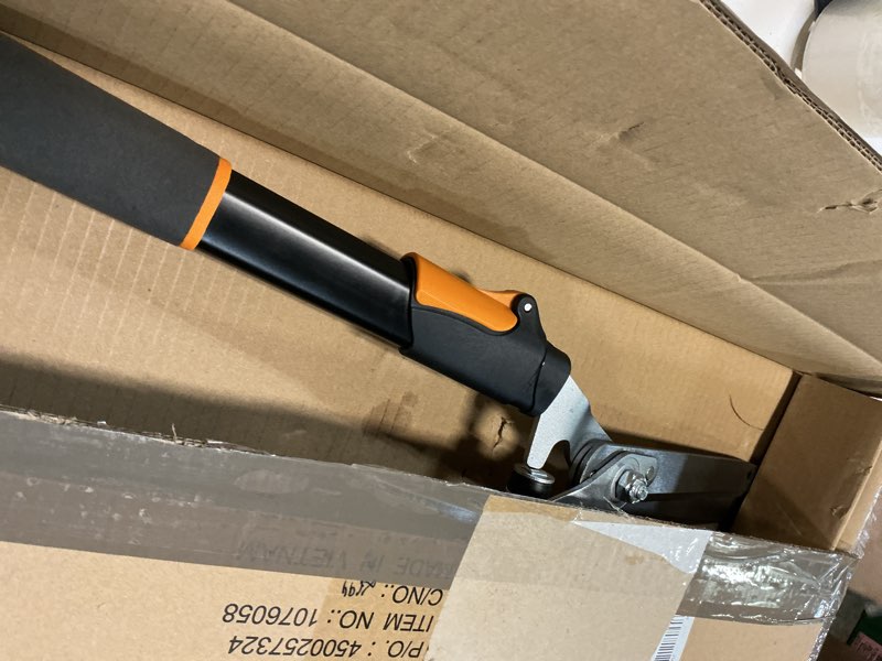 Condition photo showing Good Condition for fiskars power-lever extendable hedge shears, self-sharpening serrated steel blades for clean cuts, handles adjust 25"-33" for high reach, multiplies leverage for 2x power, 10" blades, orange/black 25-33" power-lever