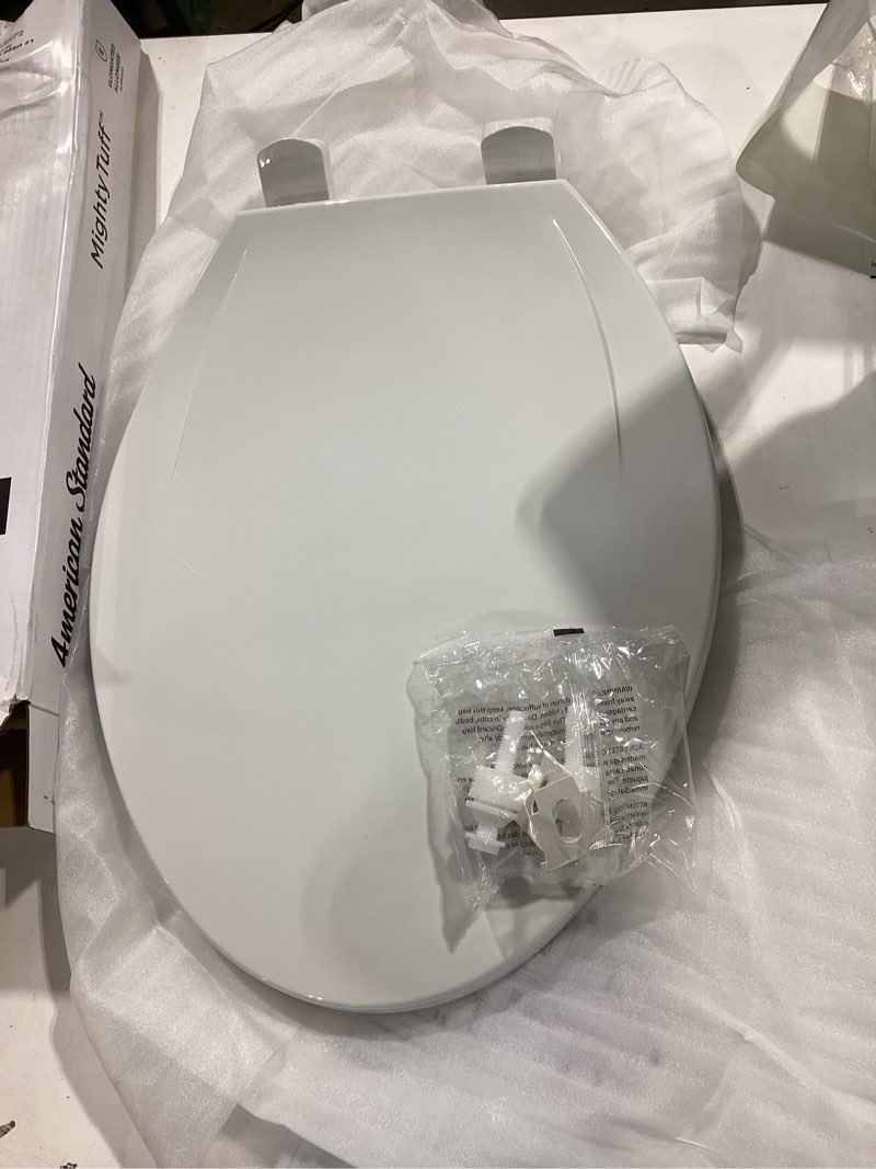Condition photo showing Good Condition for american standard mightytuff plastic white elongated soft close toilet seat