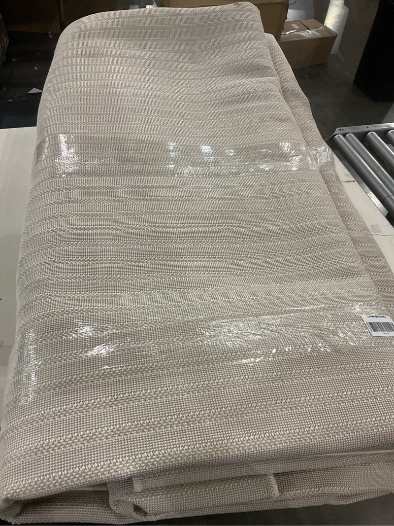 Condition photo showing As Is for JONATHAN Y Aarhus High-Low Striped Ivory/Cream Indoor/Outdoor Area Rug 12x15, Minimalist Geometric, Pet Friendly, Non-Shedding, Stain Resistant, Easy-Cleaning for Backyard, Patio (SCN102B-15) Ivory/Cream 11'10" x 15' (Rectangular)