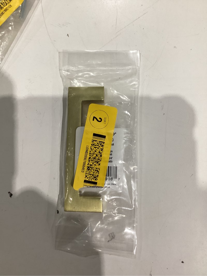 Condition photo showing New/Like New for Brainerd 3-3/4” square pull/brushed brass cabinet hardware