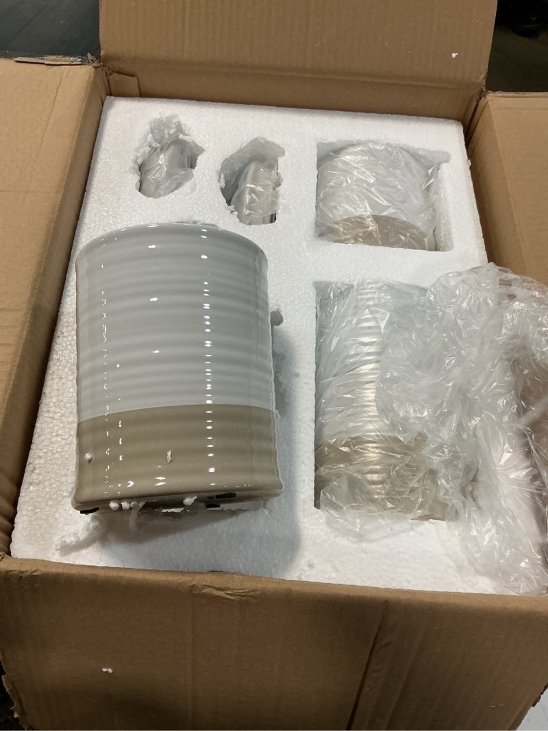 Condition photo showing New/Like New for ceramic two toned white and gray canister set of 3