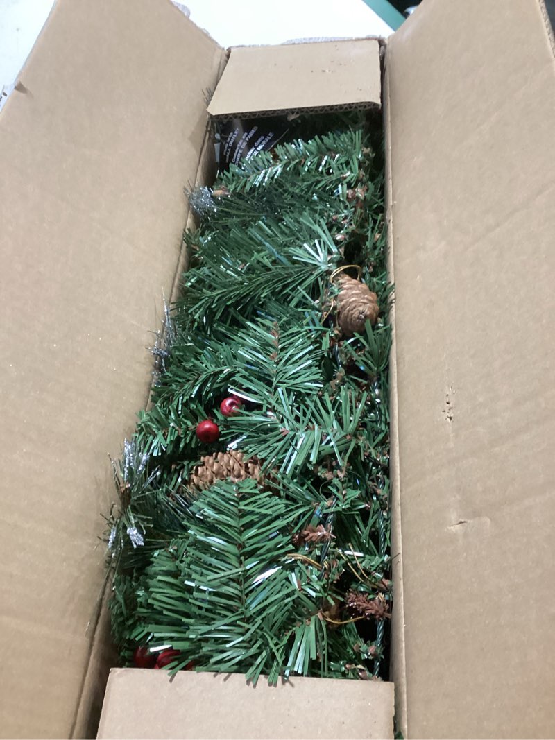 Condition photo showing As Is for National Tree Company 9 ft Pre-Lit Crestwood Spruce Artificial Christmas Garland, Christmas Decoration with Glitter, Pinecones, Red Berries, 50 Clear Lights, 180 Tips, Green Plug In Tree