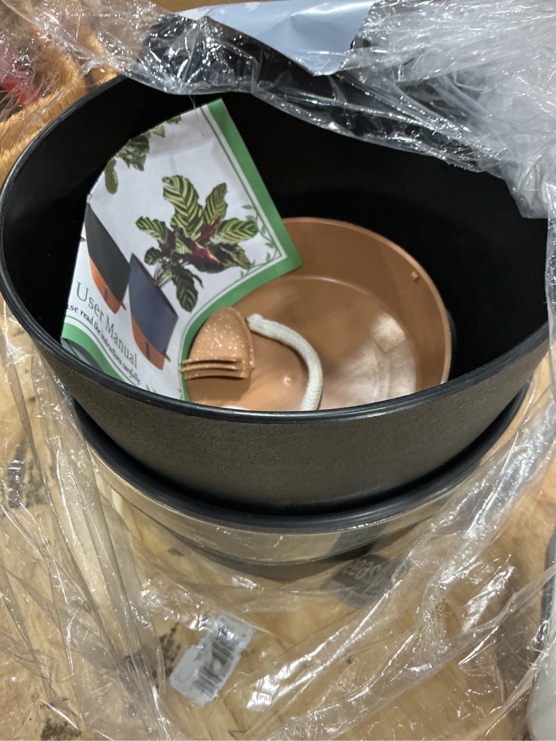 Condition photo showing Good Condition for 2 pack 10 inch plant pots, plastic self watering planters with drainage holes, deep reservoir, water level indicator, modern decorative flower pots for indoor outdoor plants (black, 10 inch) black 10 inch