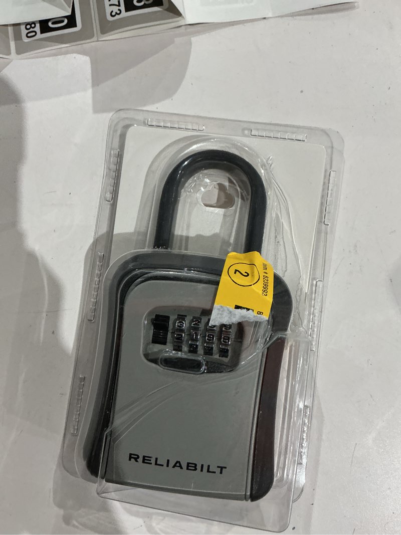Condition photo showing As Is for reliabilt wall mount combination lock box