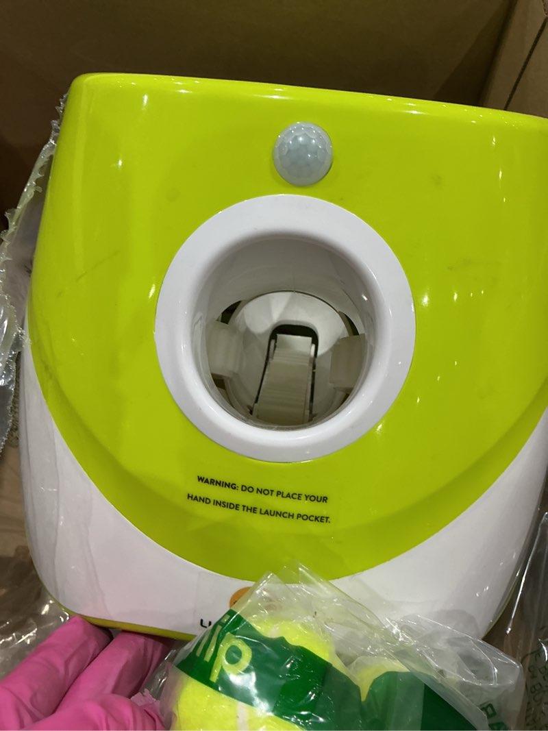 Condition photo showing As Is for elevon automatic dog ball launcher, indoor/outdoor interactive dog toy with three ranges, includes 6 mini tennis balls and a data line, suitable for small and medium-sized dogs, green