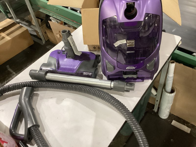 Condition photo showing As Is for *Not Tested* Kenmore 600 Series Pet Friendly Lightweight Bagged Canister Vacuum with Pet PowerMate, Pop-N-Go Brush, 2 Motors, HEPA Filter, Aluminum Telescoping Wand, Retractable Cord and 4 Cleaning Tools, Purple