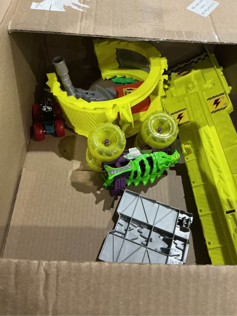 Condition photo showing As Is for hot wheels monster trucks track set with 2 toy trucks: oversized skelesaurus & 1:64 scale bone shaker, charge & chase challenge with 2 crushed cars