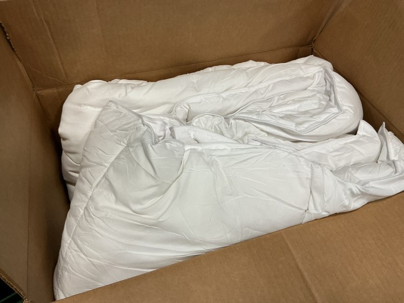 Condition photo showing As Is for amazon basics white down alternative comforter and duvet insert with corner tabs, machine washable, king, light white king light